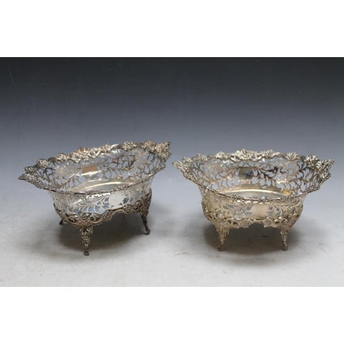 358 - A PAIR OF HALLMARKED SILVER PIERCED BASKETS BY C S HARRIES & SONS LTD - LONDON 1909, with floral bor... 