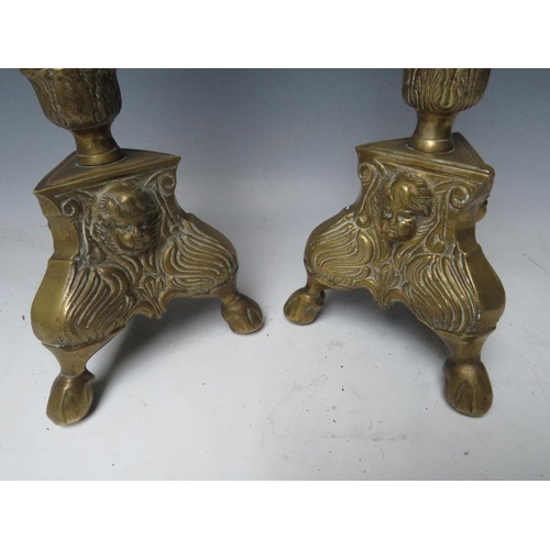 402 - A PAIR OF DECORATIVE BRASS PRICKET CANDLESTICKS, with cherubic mask detail, H 43 cm (2)