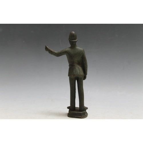 416 - A BRONZE TYPE FIGURE OF A POLICEMAN, H 16.5 cm