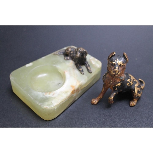 420 - A SMALL COLD PAINTED DOG ON AN ONYX DISH, together with another dog, H 6 cm (2)