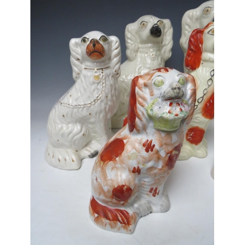 445 - A COLLECTION OF EIGHT ASSORTED STAFFORDSHIRE SEATED SPANIELS, to include a large pair, H 30.5 cm (8)