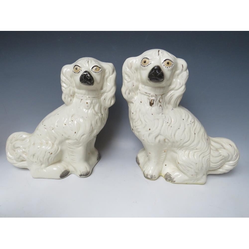 445 - A COLLECTION OF EIGHT ASSORTED STAFFORDSHIRE SEATED SPANIELS, to include a large pair, H 30.5 cm (8)