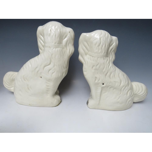 445 - A COLLECTION OF EIGHT ASSORTED STAFFORDSHIRE SEATED SPANIELS, to include a large pair, H 30.5 cm (8)