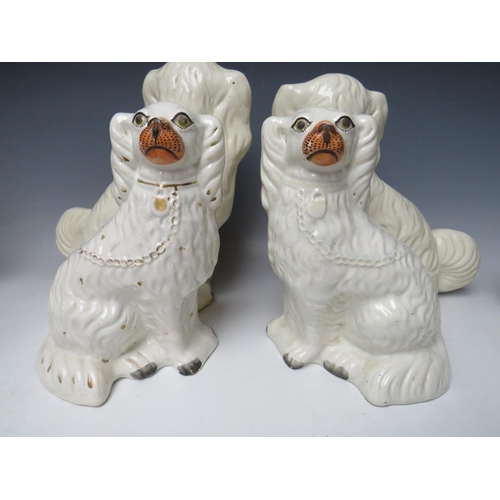 445 - A COLLECTION OF EIGHT ASSORTED STAFFORDSHIRE SEATED SPANIELS, to include a large pair, H 30.5 cm (8)