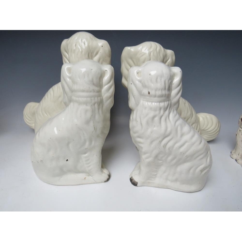 445 - A COLLECTION OF EIGHT ASSORTED STAFFORDSHIRE SEATED SPANIELS, to include a large pair, H 30.5 cm (8)