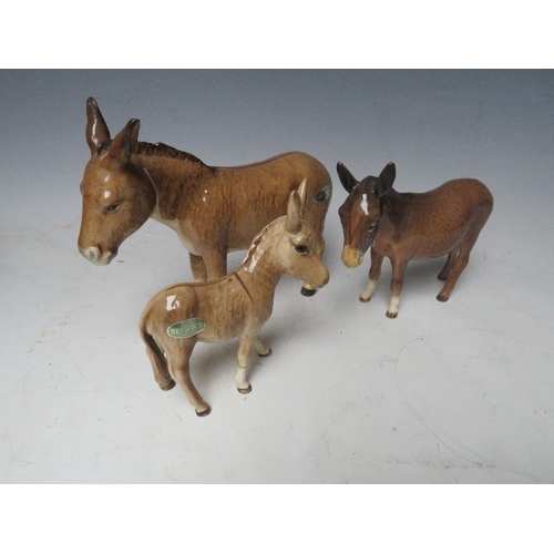 448 - TWO BESWICK DONKEYS WITH A FOAL (3)S/DCondition Report:Foal leg glued, ear loose