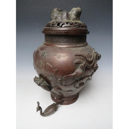 466 - A LARGE LATE 19TH / EARLY 20TH CENTURY BRONZE BALUSTER TEMPLE JAR AND COVER, the body decorated with... 