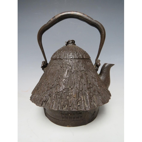 467 - A 20TH CENTURY CAST IRON JAPANESE TEAPOT, together with a brass lozenge shaped casket, the teapot ha... 