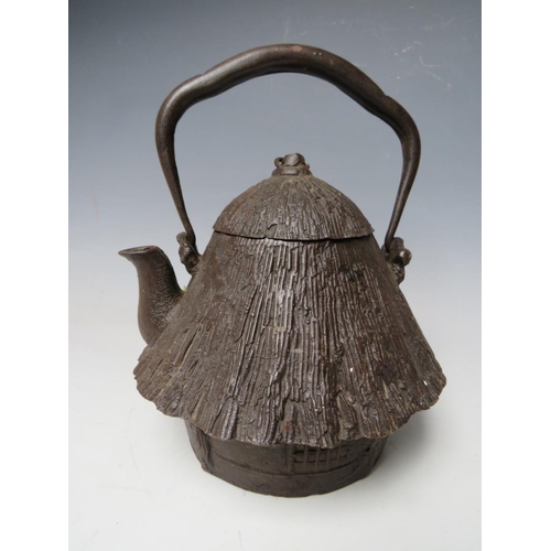 467 - A 20TH CENTURY CAST IRON JAPANESE TEAPOT, together with a brass lozenge shaped casket, the teapot ha... 