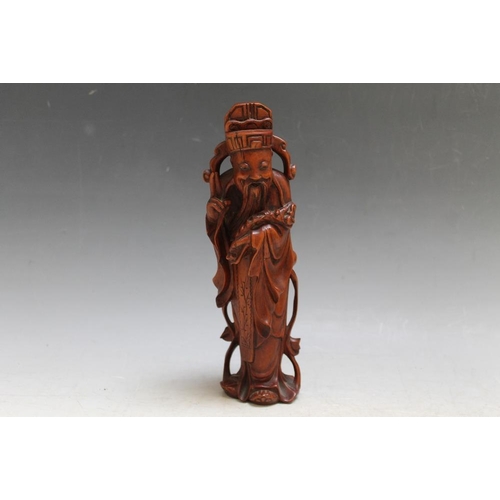 468 - A CARVED CHINESE FIGURE, H 21 cm