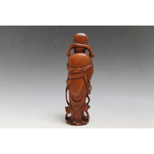 468 - A CARVED CHINESE FIGURE, H 21 cm