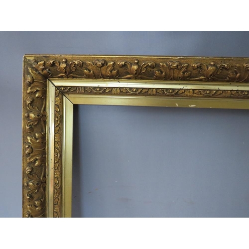 47 - A 19TH CENTURY GOLD FRAME WITH LEAF DESIGN AND INTEGRAL GOLD SLIP, frame W 11 cm, rebate 65 x 45 cm