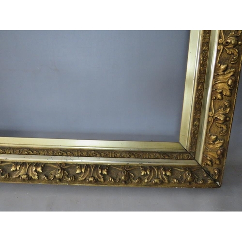 47 - A 19TH CENTURY GOLD FRAME WITH LEAF DESIGN AND INTEGRAL GOLD SLIP, frame W 11 cm, rebate 65 x 45 cm