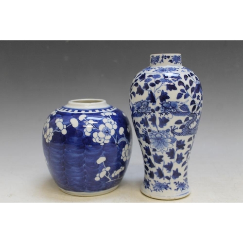 471 - A CHINESE BLUE AND WHITE VASE DECORATED WITH DRAGONS, four character mark to base,  A/F, H 18.5 cm t... 