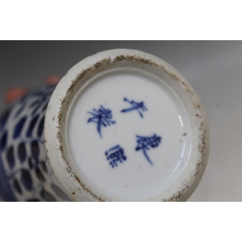 471 - A CHINESE BLUE AND WHITE VASE DECORATED WITH DRAGONS, four character mark to base,  A/F, H 18.5 cm t... 