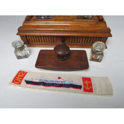 474 - A SMALL DECORATIVE WOODEN DESK STAND WITH SINGLE DRAWER BELOW, complete with two fitted ink bottles ... 