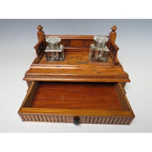 474 - A SMALL DECORATIVE WOODEN DESK STAND WITH SINGLE DRAWER BELOW, complete with two fitted ink bottles ... 