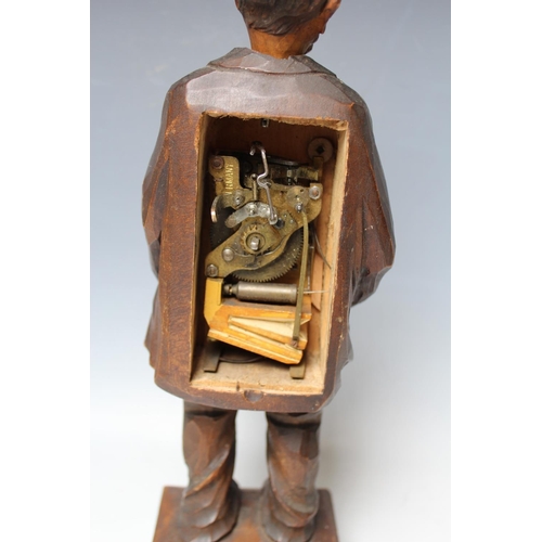 479 - A BLACK FOREST CARVED SOFTWOOD 'WHISTLING FIGURE', circa 1930, in the form of a man with his hands i... 