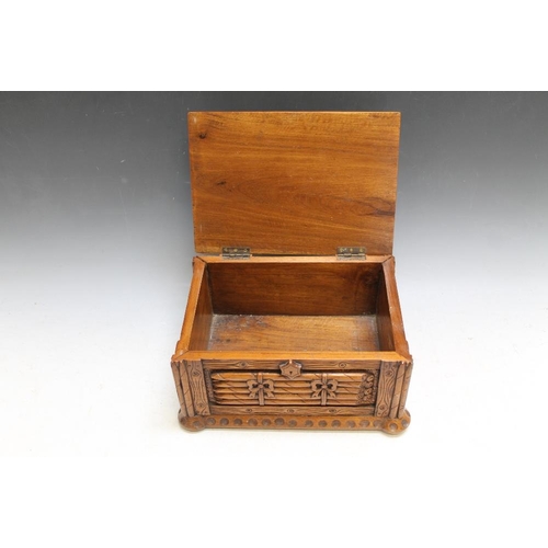 483 - A HEAVILY CARVED CIGAR HUMIDOR BOX,  W 28 cmCondition Report:split at one corner join