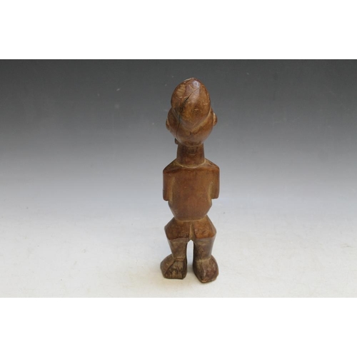 493 - A CARVED WOODEN AFRICAN TRIBAL FIGURE, H 30 cm