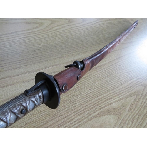 503 - A WW2 JAPANESE SAMURAI KATANA SWORD, with alloy handle, steel saya and leather sheath