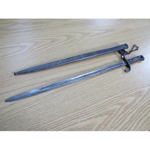 504 - A WW1 BAYONET WITH METAL SCABBARD, blade L 54.5 cm