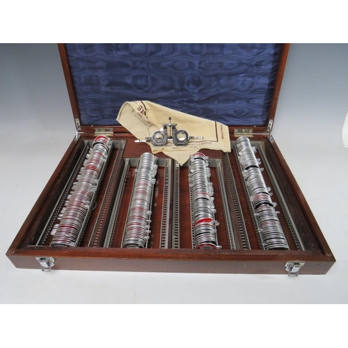 519 - A LARGE OPTICIANS TRIAL LENS SET WITH CLEMENT CLARKE HOLDER, in mahogany case