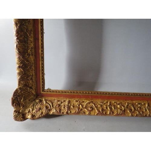 53 - A 19TH CENTURY DECORATIVE GOLD SWEPT FRAME, frame W 6.5 cm, rebate 74 x 54 cm