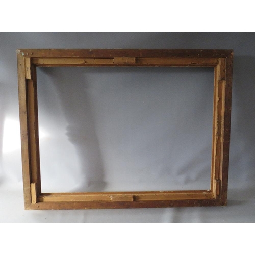 53 - A 19TH CENTURY DECORATIVE GOLD SWEPT FRAME, frame W 6.5 cm, rebate 74 x 54 cm