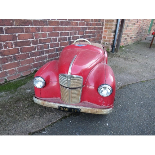 542 - AN ORIGINAL AUSTIN J40 PEDAL CAR, finished in red with chrome fixtures and fittings, complete with h... 