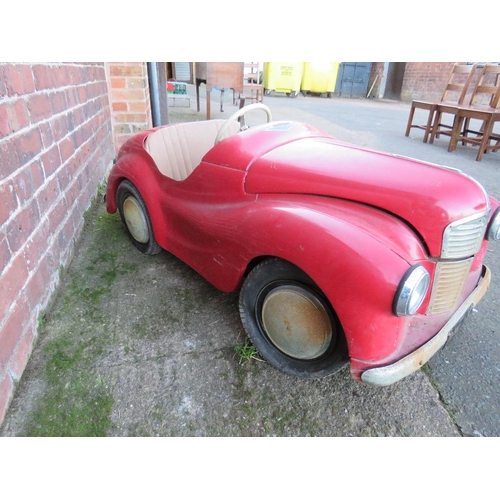 542 - AN ORIGINAL AUSTIN J40 PEDAL CAR, finished in red with chrome fixtures and fittings, complete with h... 