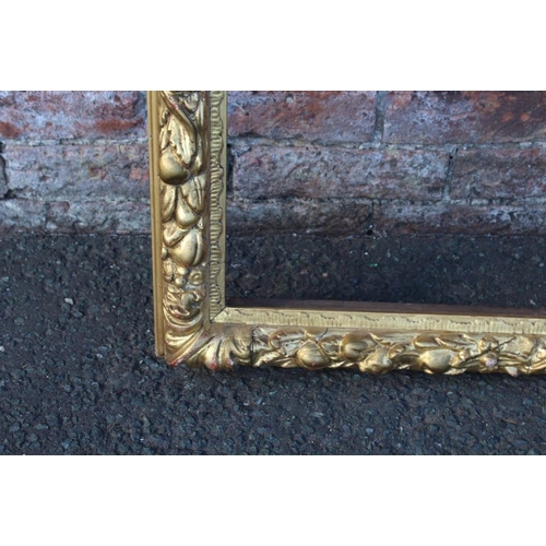 55 - A LATE 18TH / EARLY 19TH CENTURY DECORATIVE GOLD FRAME WITH FRUIT DESIGN, frame W 7.5 cm, rebate 72 ... 