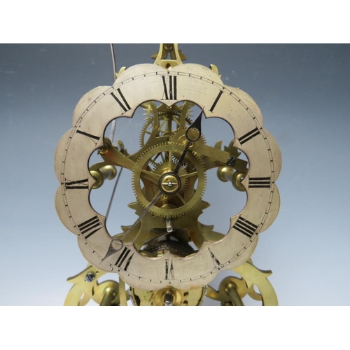 555 - A GOOD QUALITY BELL STRIKE SKELETON CLOCK WITH GLASS DOME, the hand cut brass frame having a silvere... 