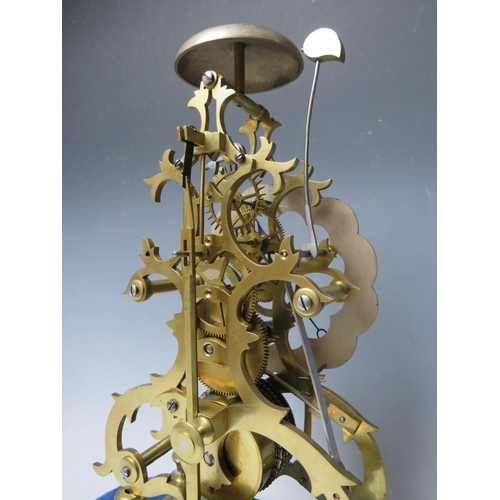 555 - A GOOD QUALITY BELL STRIKE SKELETON CLOCK WITH GLASS DOME, the hand cut brass frame having a silvere... 