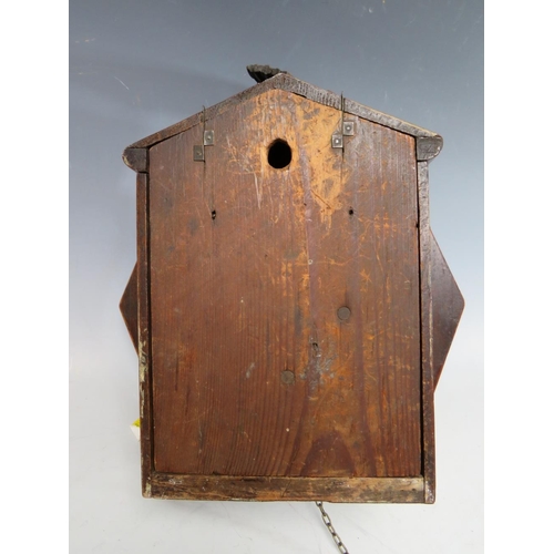 559 - A 19TH CENTURY 8 DAY CUCKOO CLOCK, with brass weights and pendulum, the mahogany octagonal case with... 