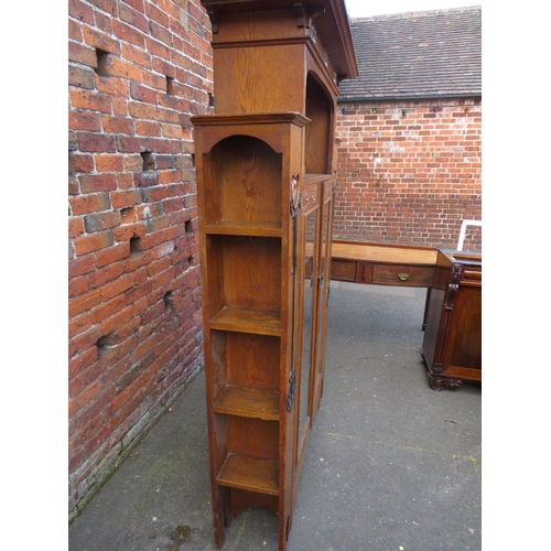 567 - AN EARLY 20TH CENTURY ARTS AND CRAFTS CABINET, having typical copper stylised mounts to the front, w... 