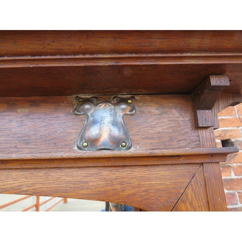 567 - AN EARLY 20TH CENTURY ARTS AND CRAFTS CABINET, having typical copper stylised mounts to the front, w... 