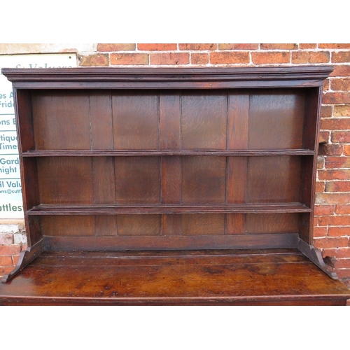 568 - AN 18TH CENTURY OAK WELSH DRESSER, the base with an arrangement of five drawers and two cupboards, a... 