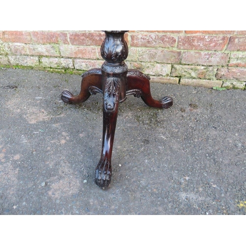 570 - AN ANTIQUE MAHOGANY 'BIRDCAGE' PEDESTAL TABLE, the shaped top with carved detail, raised on a carved... 