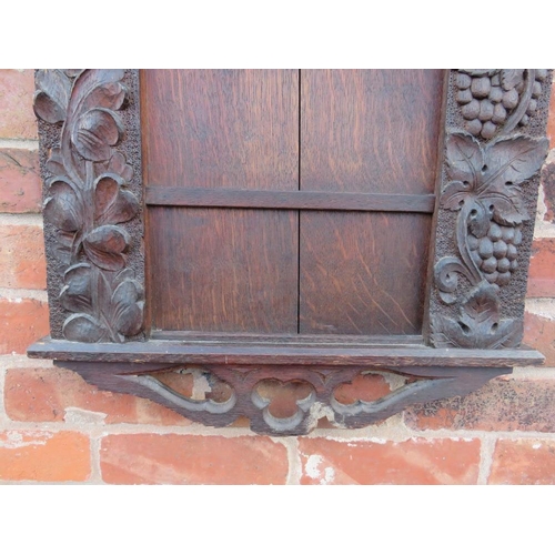 571 - AN EARLY 20TH CENTURY OAK 'PSALMS' ECCLESIASTICAL HYMN BOARD, carved with fruit and floral detail, H... 