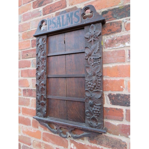 571 - AN EARLY 20TH CENTURY OAK 'PSALMS' ECCLESIASTICAL HYMN BOARD, carved with fruit and floral detail, H... 