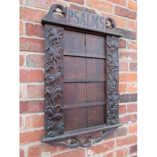 571 - AN EARLY 20TH CENTURY OAK 'PSALMS' ECCLESIASTICAL HYMN BOARD, carved with fruit and floral detail, H... 