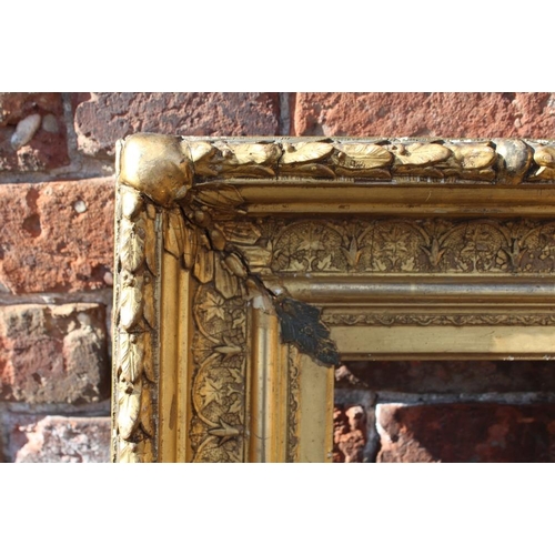 58 - AN 18TH CENTURY CONTINENTAL DECORATIVE GOLD FRAME, with acanthus leaf design to outer edge, frame W ... 