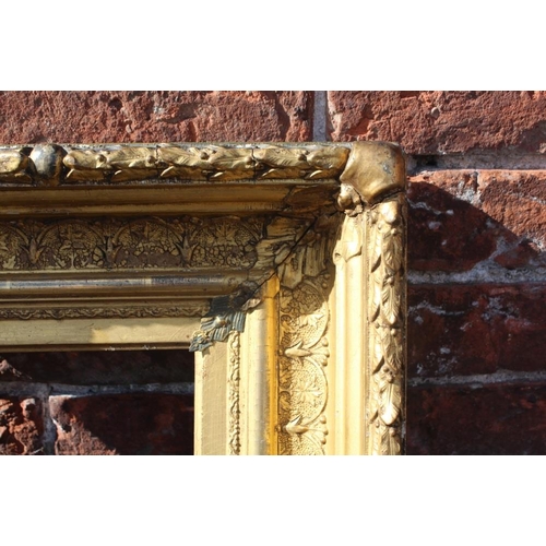 58 - AN 18TH CENTURY CONTINENTAL DECORATIVE GOLD FRAME, with acanthus leaf design to outer edge, frame W ... 