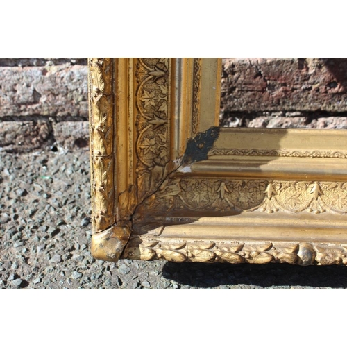 58 - AN 18TH CENTURY CONTINENTAL DECORATIVE GOLD FRAME, with acanthus leaf design to outer edge, frame W ... 