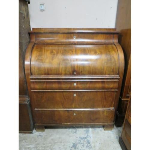 584 - A 19TH CENTURY BIEDERMEIER STYLE MAHOGANY CYLINDER BUREAU HAVING A FITTED INTERIOR,  the pull-out wr... 