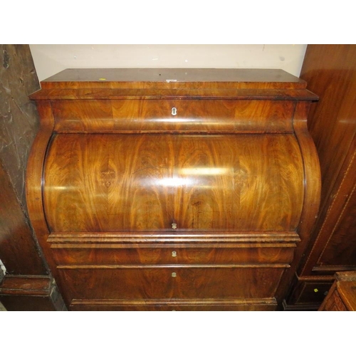 584 - A 19TH CENTURY BIEDERMEIER STYLE MAHOGANY CYLINDER BUREAU HAVING A FITTED INTERIOR,  the pull-out wr... 