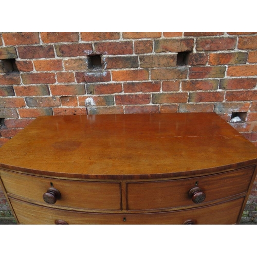 585 - A 19TH CENTURY MAHOGANY BOW FRONTED CHEST OF TWO SHORT ABOVE THREE LONGER GRADUATED DRAWERS, with la... 