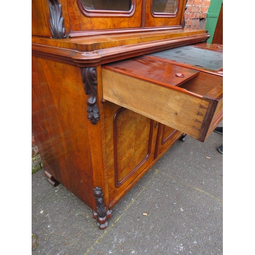 587 - A 19TH CENTURY WALNUT GLAZED BOOKCASE, the upper section with twin glazed doors and carved moulded d... 