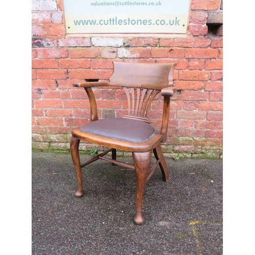 591 - AN EARLY 20TH CENTURY OAK OFFICE ARMCHAIR, with upholstered seat, raised on cabriole supports